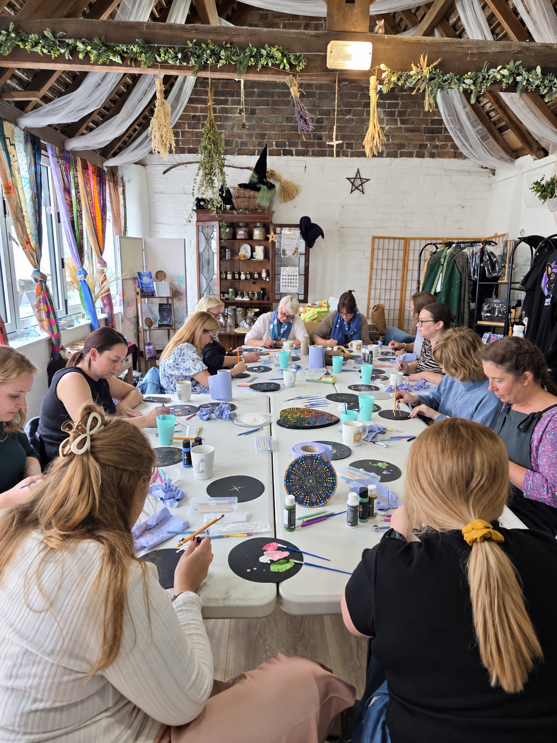 A creative community workshop around the long table at The Wenlock Witch